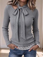 Ribbed Knit Top With A Tie-bow Neckline And A Lace Hem