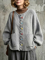 Loose-fit, Drop-shoulder Knit Cardigan Featuring A Wavy Placket, Decorative Colorful Buttons, And Large Patch Pockets