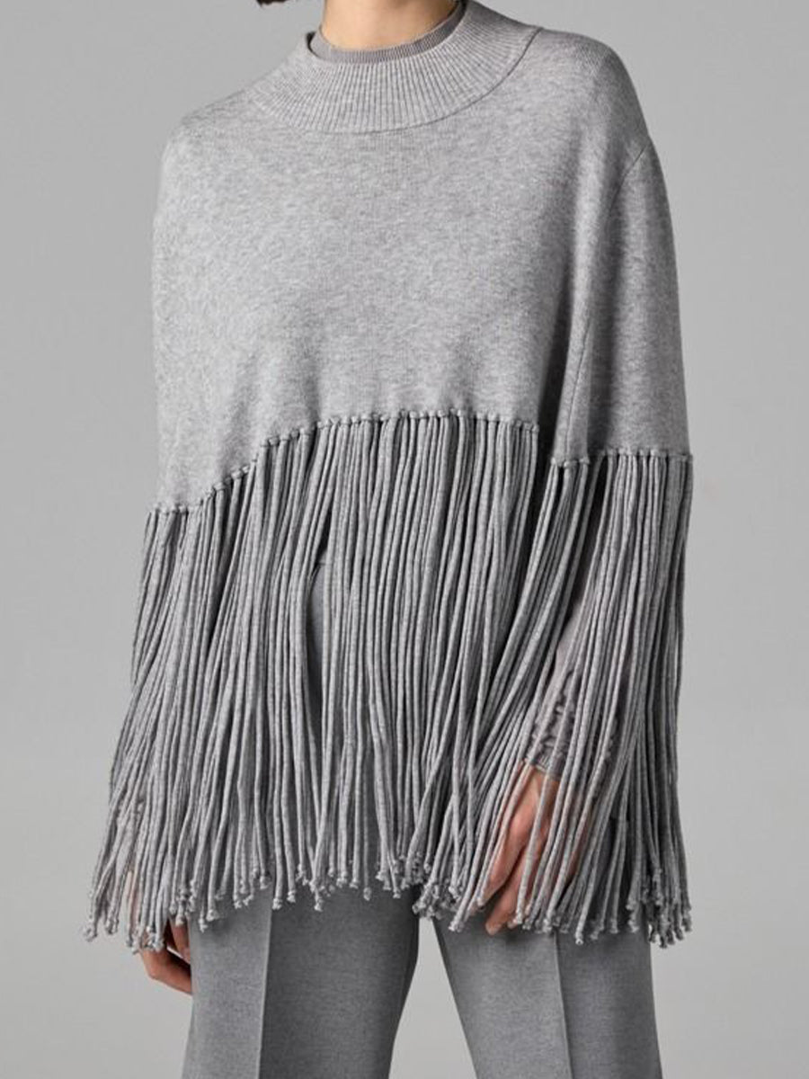 Stylish, Loose-fitting Knit Cape-style Sweater With Fringe Details.