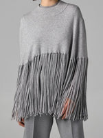 Stylish, Loose-fitting Knit Cape-style Sweater With Fringe Details.