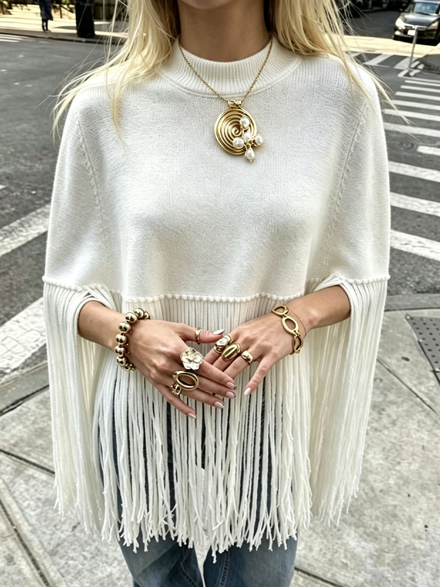 Stylish, Loose-fitting Knit Cape-style Sweater With Fringe Details.