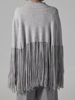 Stylish, Loose-fitting Knit Cape-style Sweater With Fringe Details.