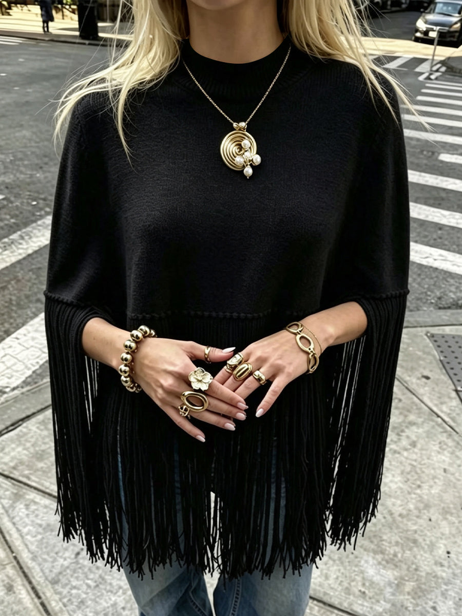 Stylish, Loose-fitting Knit Cape-style Sweater With Fringe Details.