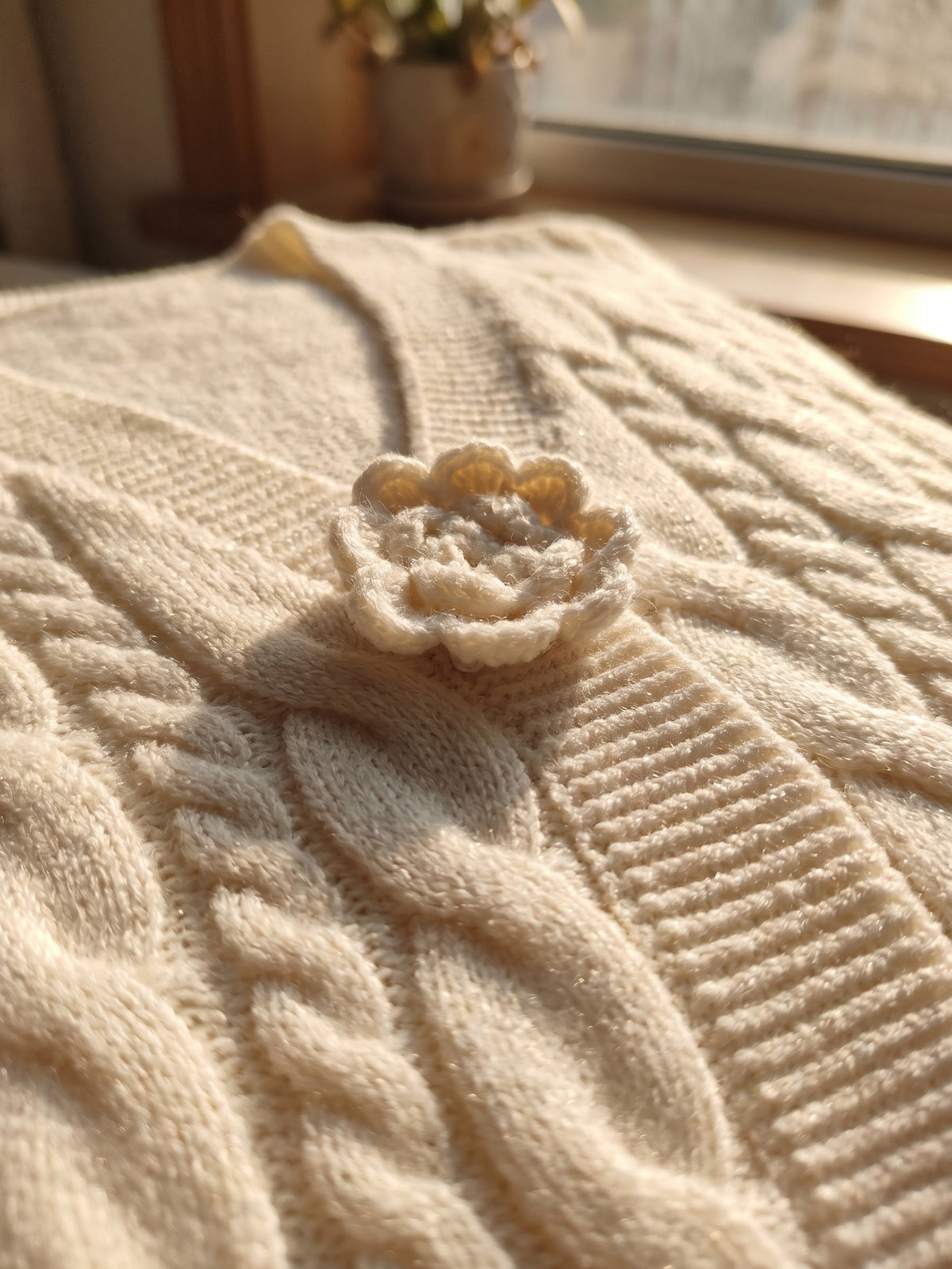 Chic Cream Floral Accented Cable-Knit Cardigan